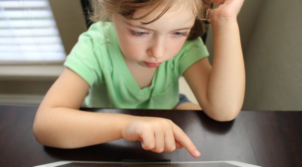 training Communicating with Children - child pointing at computer screen